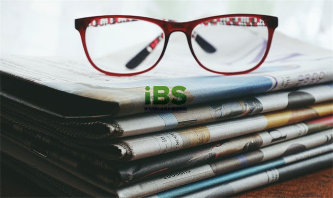 red-framed-eyeglasses-on-newspapers-3886870.jpg